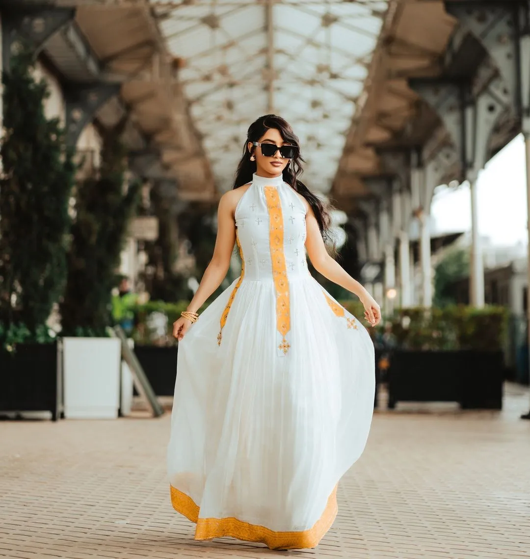 Golden-Orange Cross-Stitched Modern Habesha Dress: Relaxed Fit for Outdoors Traditional Ethiopian Dress