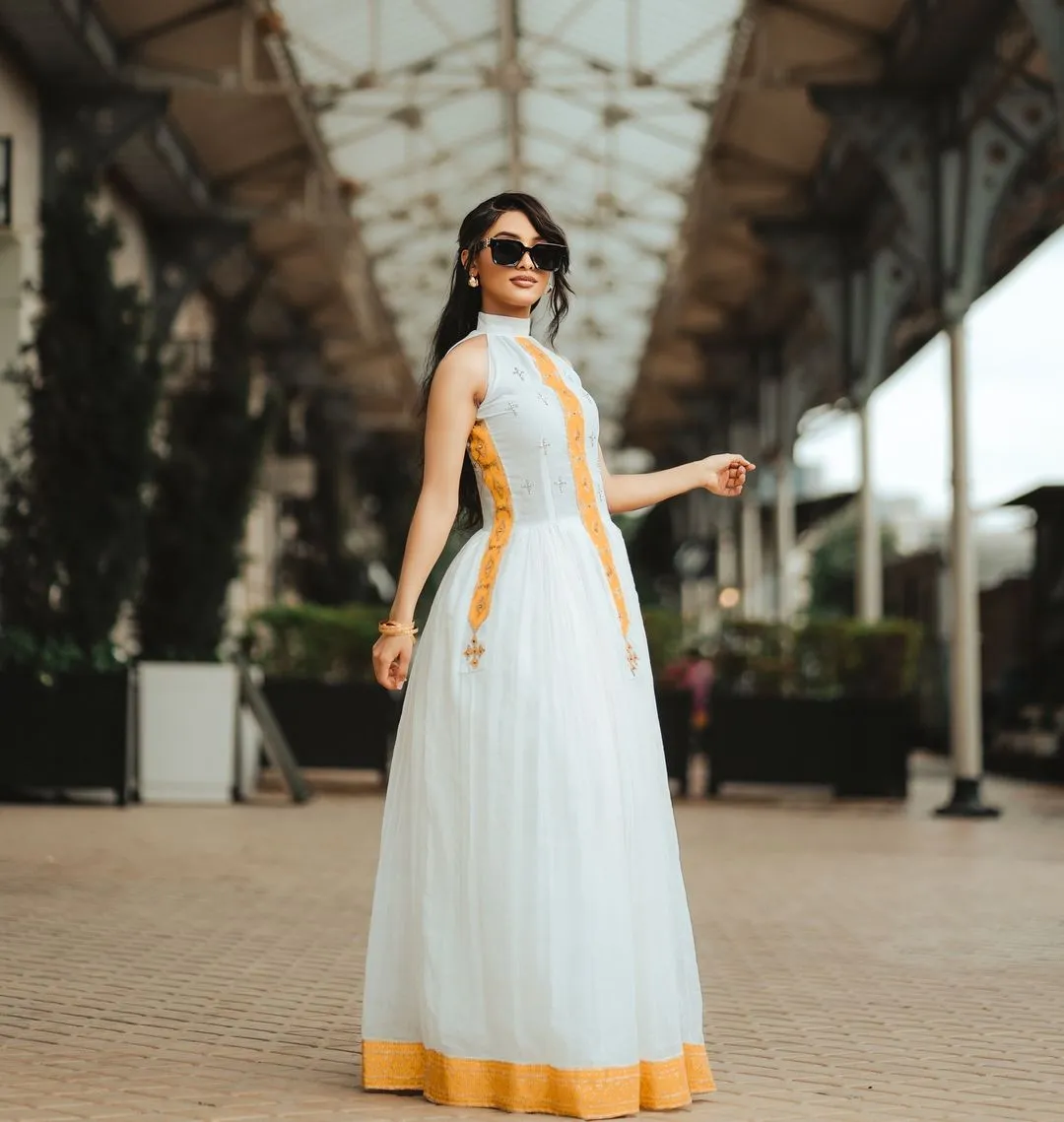 Golden-Orange Cross-Stitched Modern Habesha Dress: Relaxed Fit for Outdoors Traditional Ethiopian Dress